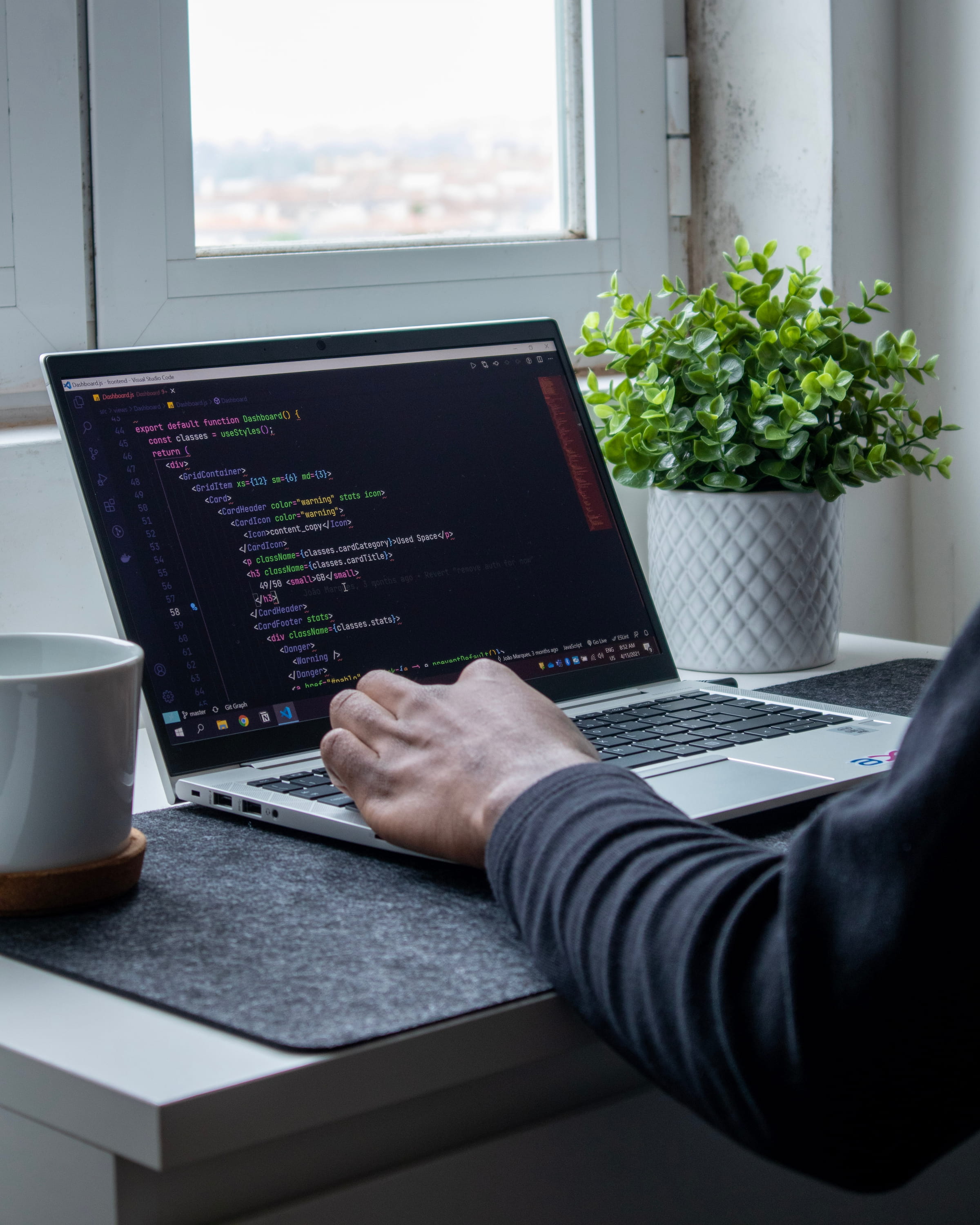 Modern web development workspace showing a laptop used for website engineering and design work